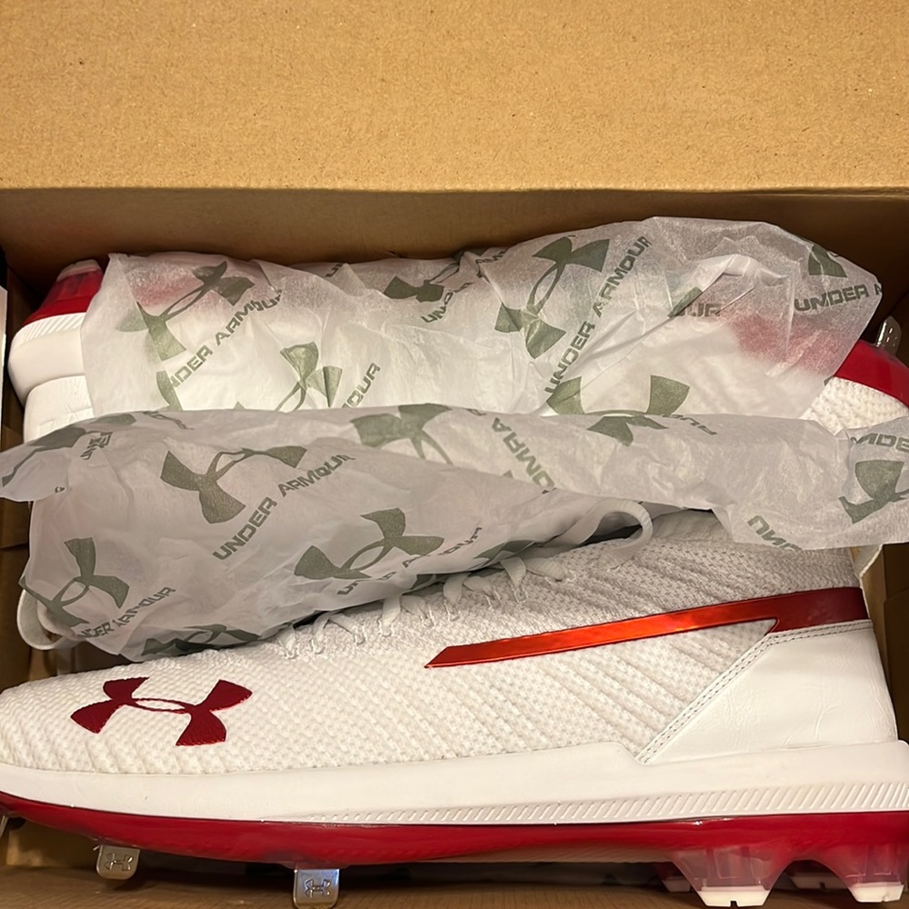 Size 13.5 baseball cleats, perfect condition, never worn. White/red, metal.